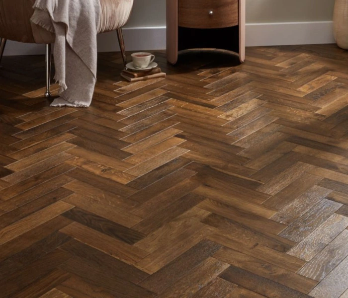 Oak herringbone parquet flooring in a cozy room.